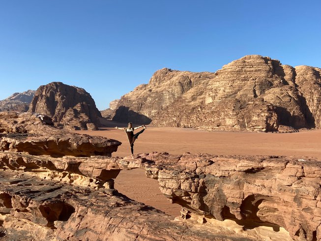 woman doing yoga after hiking in Wadi Rum