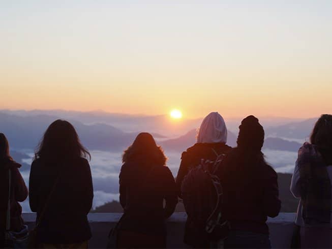 group of people watching the sunset in India