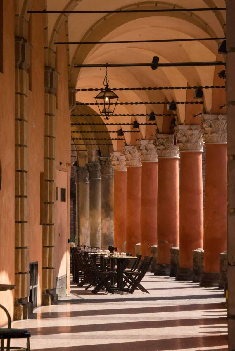 Outdoor seating of a restaurant in Bologna, Italy.