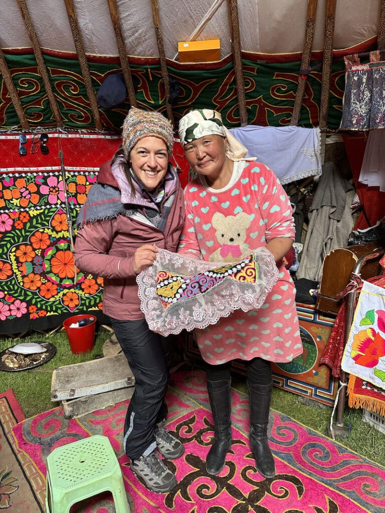 woman making Kazakh embroidery in the Altai Mountains