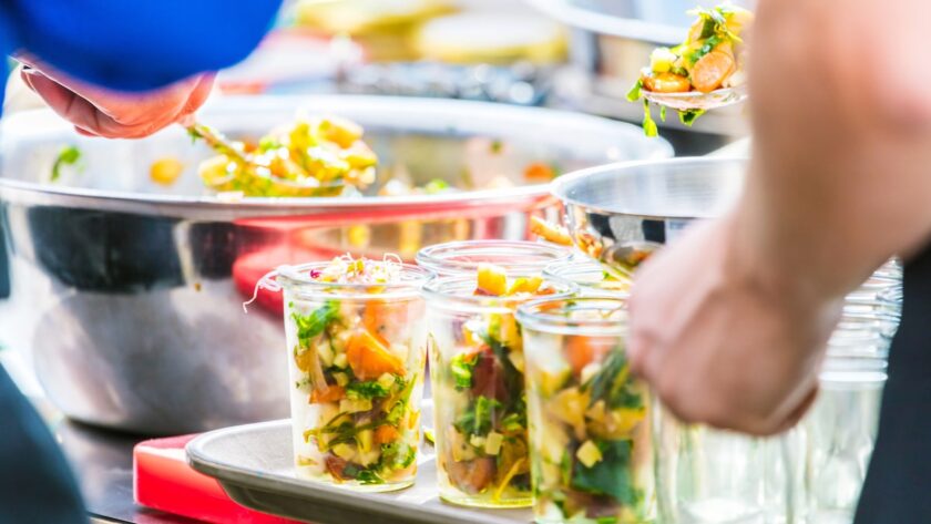 couple staying at a vegan resort in the US getting meat-free food from the buffet line