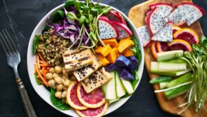 plant-based eater enjoying a grilled tofu and dragon fruit buddha bowl at one of Vancouver's best vegan restaurants