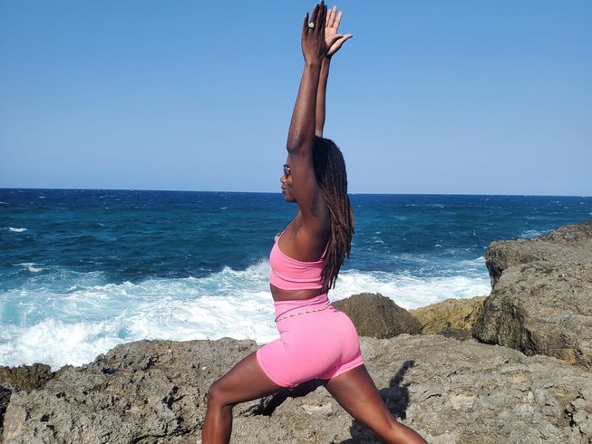 woman doing yoga on the beach in Jamaica