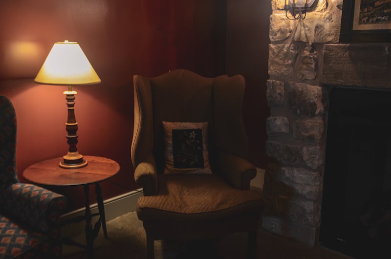 Inside the cozy, 19th-century style living room in one of Hermannhof Inn's cellars