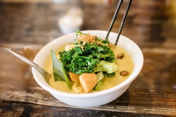 a bowl of Golden Temple Soup served at the vegan Vancouver restaurant Chau Veggie Express