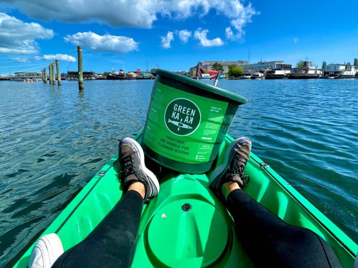 woman paddling with GreenKayak to sightsee while cleaning up the Copenhagen harbour canals