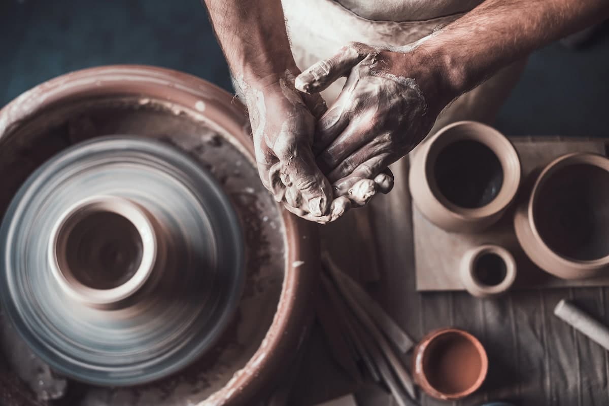 hands making homemade pottery for more sustainable gift giving during the holidays