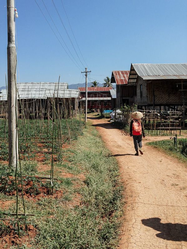 an Inle Lake trekking guide hiking through local Myanmar villages