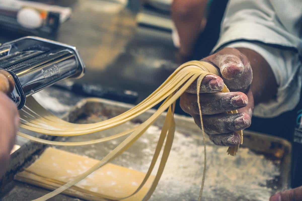A person making homemade pasta.