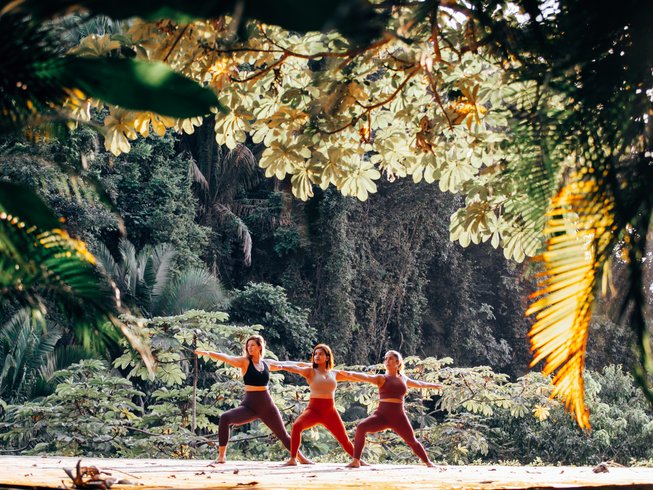 Women doing yoga on one of the top plant-based yoga retreats in Mexico