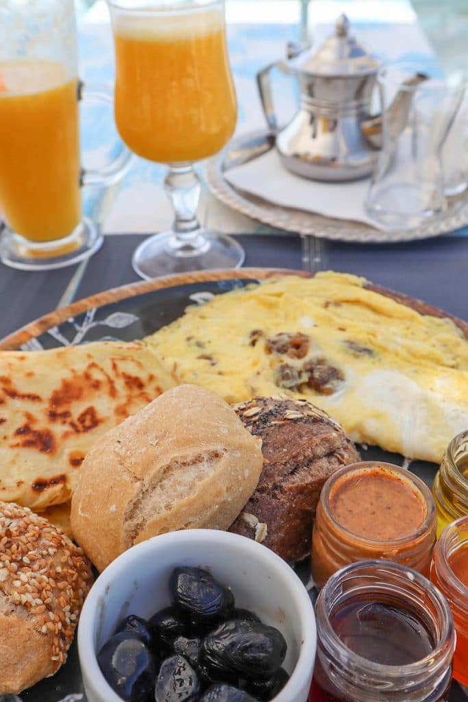Olive oil, cheese, honey & bread are common foods on a traditional Moroccan breakfast table