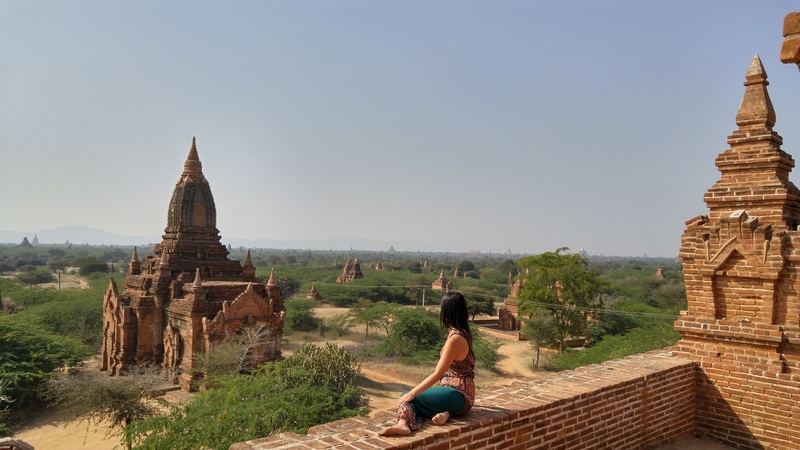 woman gazing out over temples in Bagan