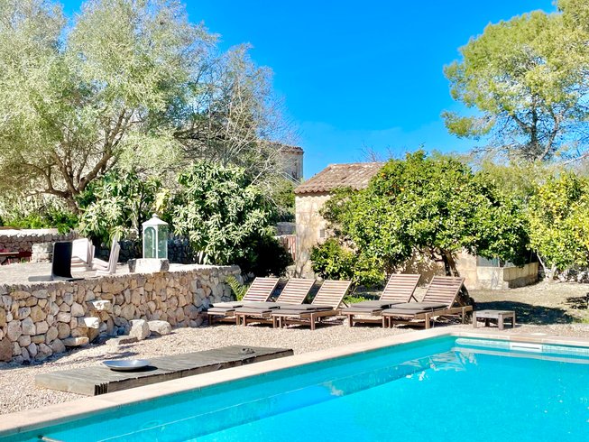 pool surrounded by lounge chairs