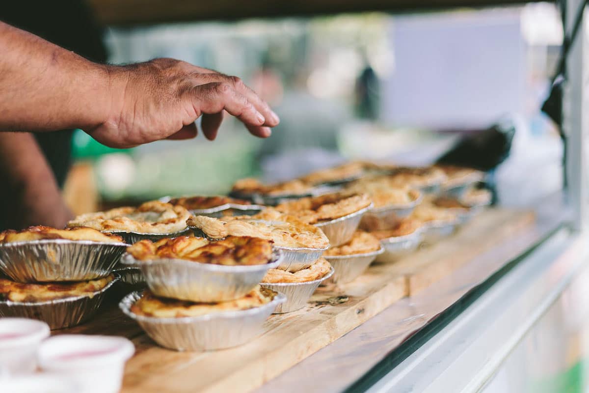 A man selling pies at a market in Dublin, Ireland.