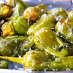 Pimientos de Padrón, a Spanish vegan dish featuring small green peppers sautéed with sea salt.