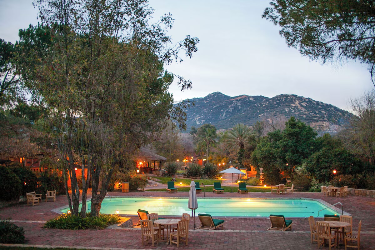 outdoor pool surrounded by mountains at the Rancho La Puerta vegan resort in Mexico