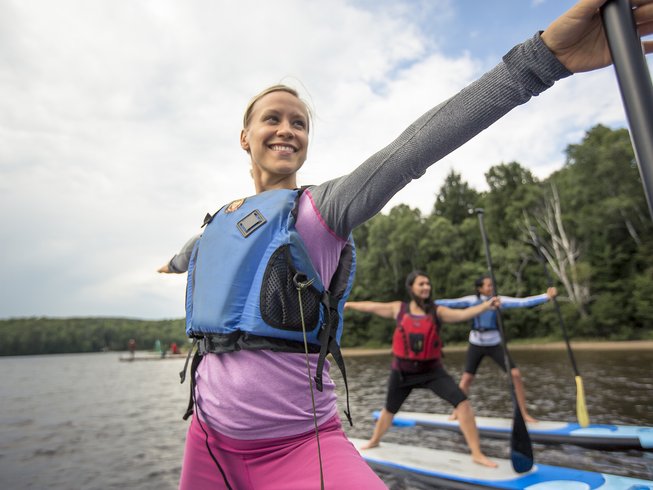 women on a SUP yoga retreat in Ontario, Canada