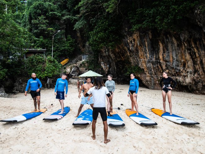 people on the beach learning to surf during a Bali retreat