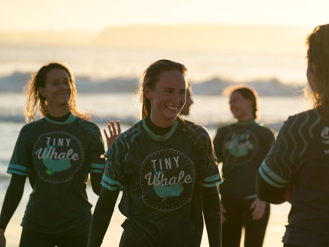 group of women smiling and meeting each other on a women's yoga and surf retreat in Portugal
