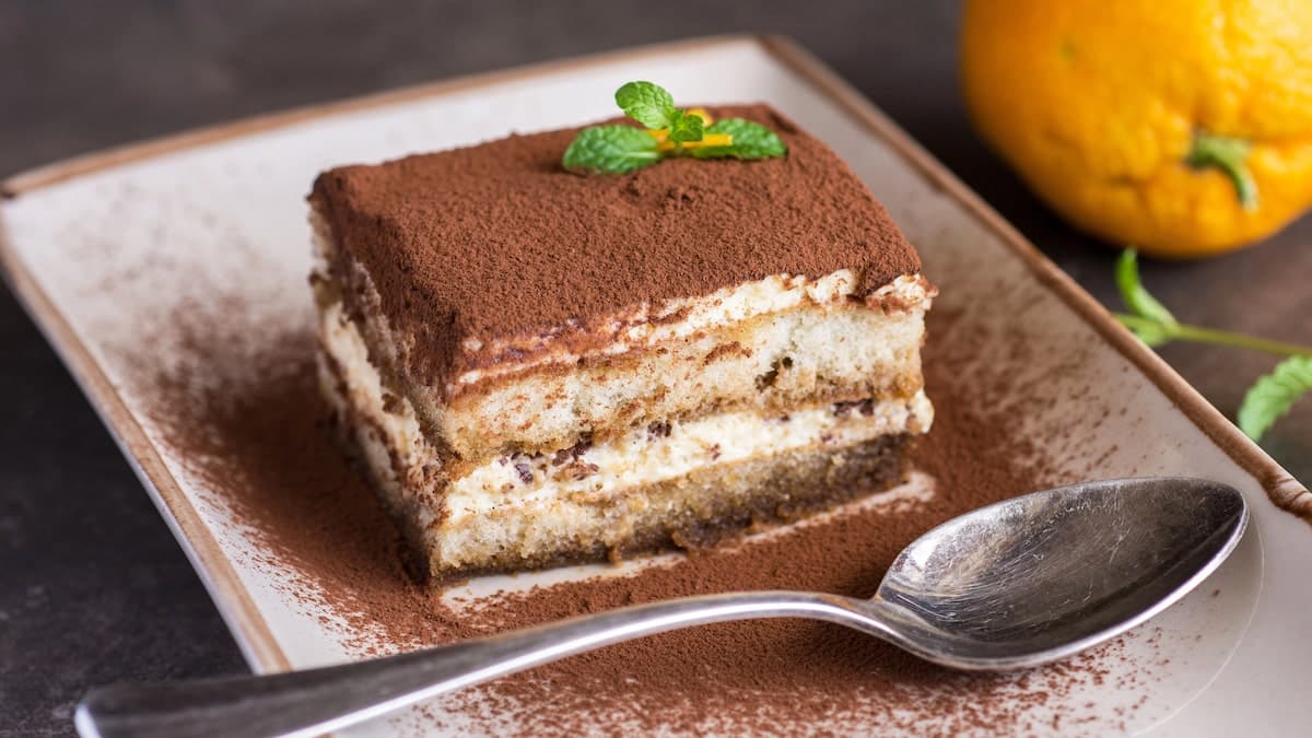 Italian Tiramisu cake on a white plate