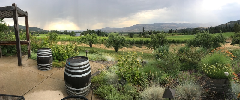 outdoor patio at Upper Five Vineyard overlooking the wine grapes and Rogue Valley