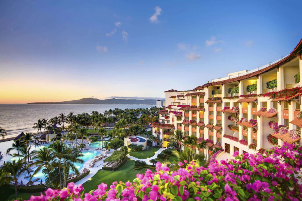 pool and gardens with purple flowers at the Grand Velas Riviera Nayarit 