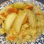 plate filled with fruit plov vegetarian food in Uzbekistan