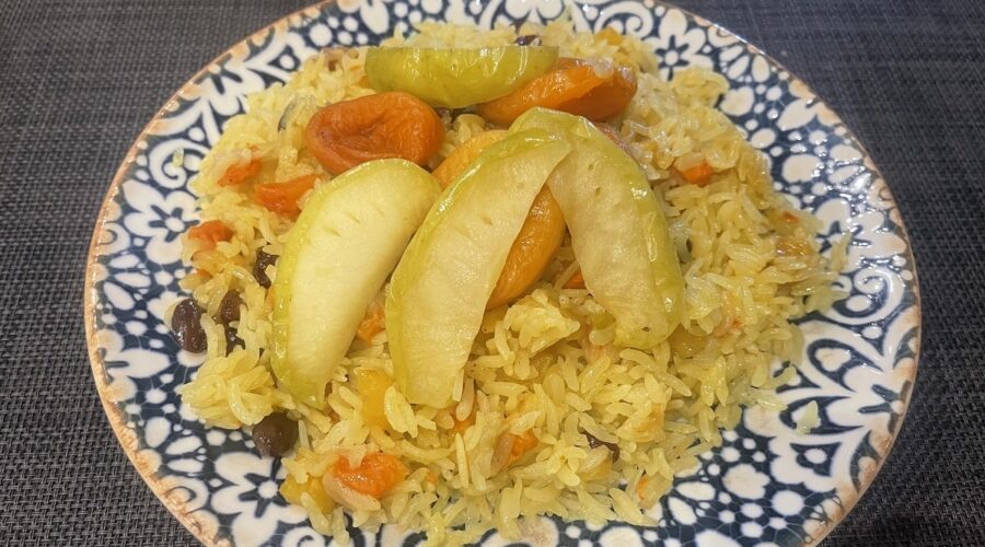 plate filled with fruit plov vegetarian food in Uzbekistan