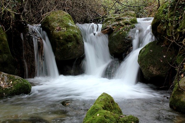 seeing waterfalls during a yoga adventure trip in Spain