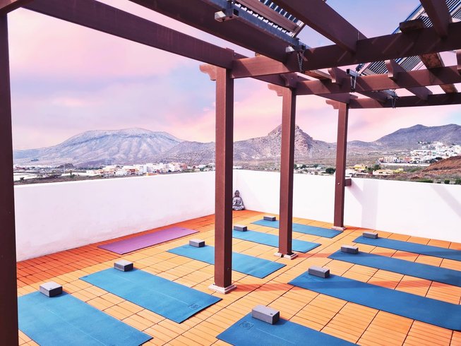 outdoor deck with blue yoga mats laid out in Tenerife, Spain