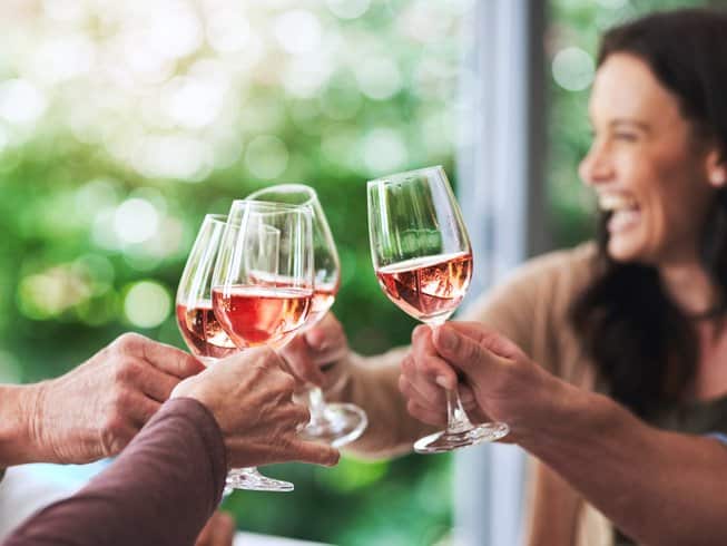 group of people on a wine and yoga retreat in the Barossa Valley clinking glasses