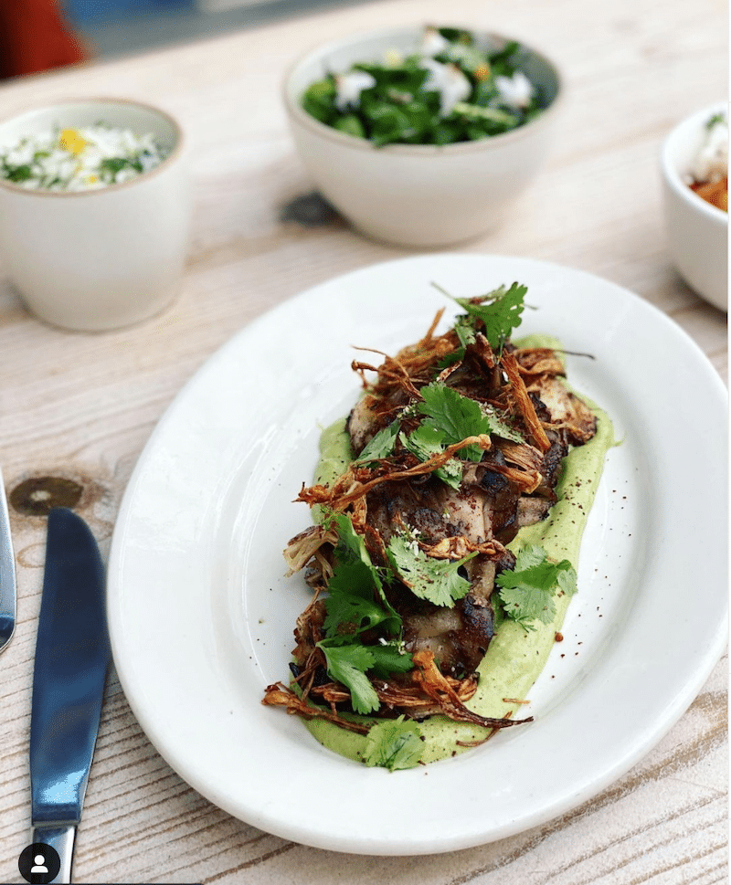 Recipe sharing platform highlighting Seared Maitake Mushrooms on Green Tahini