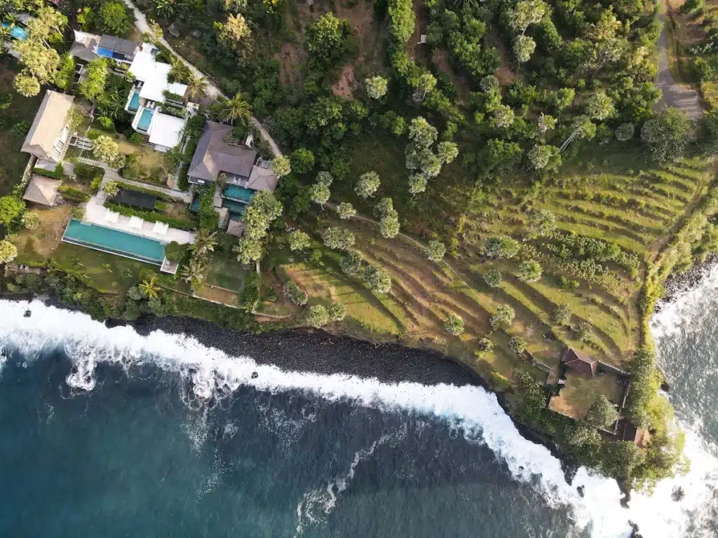 aerial view of the vegan Shunyata Villas Bali Resort in Karangasem surrounded by palm trees